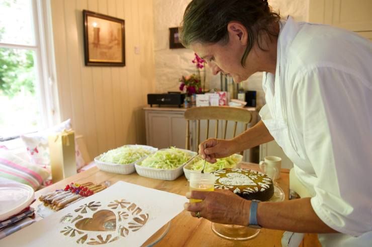 Annie decorating cake